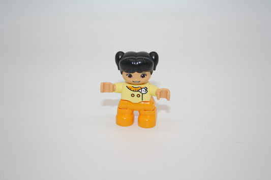 Duplo - Mädchen - schwarze Haare - gelbe Kleidung mit Hundekopf auf der Brust - Figur - neu/unbespielt