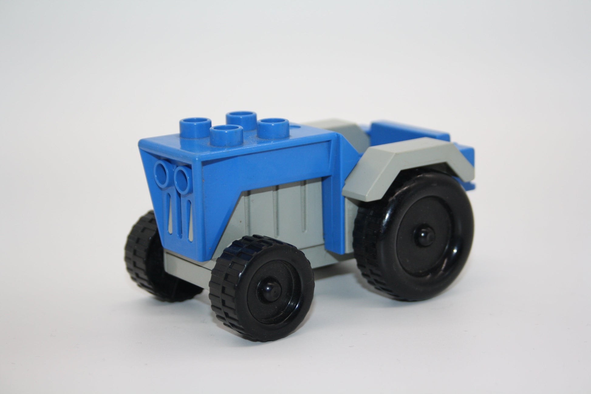 Duplo - kl. Traktoren/Trecker - versch. Farben - Bauernhof - Fahrzeuge - blau-grau - Fahrzeuge