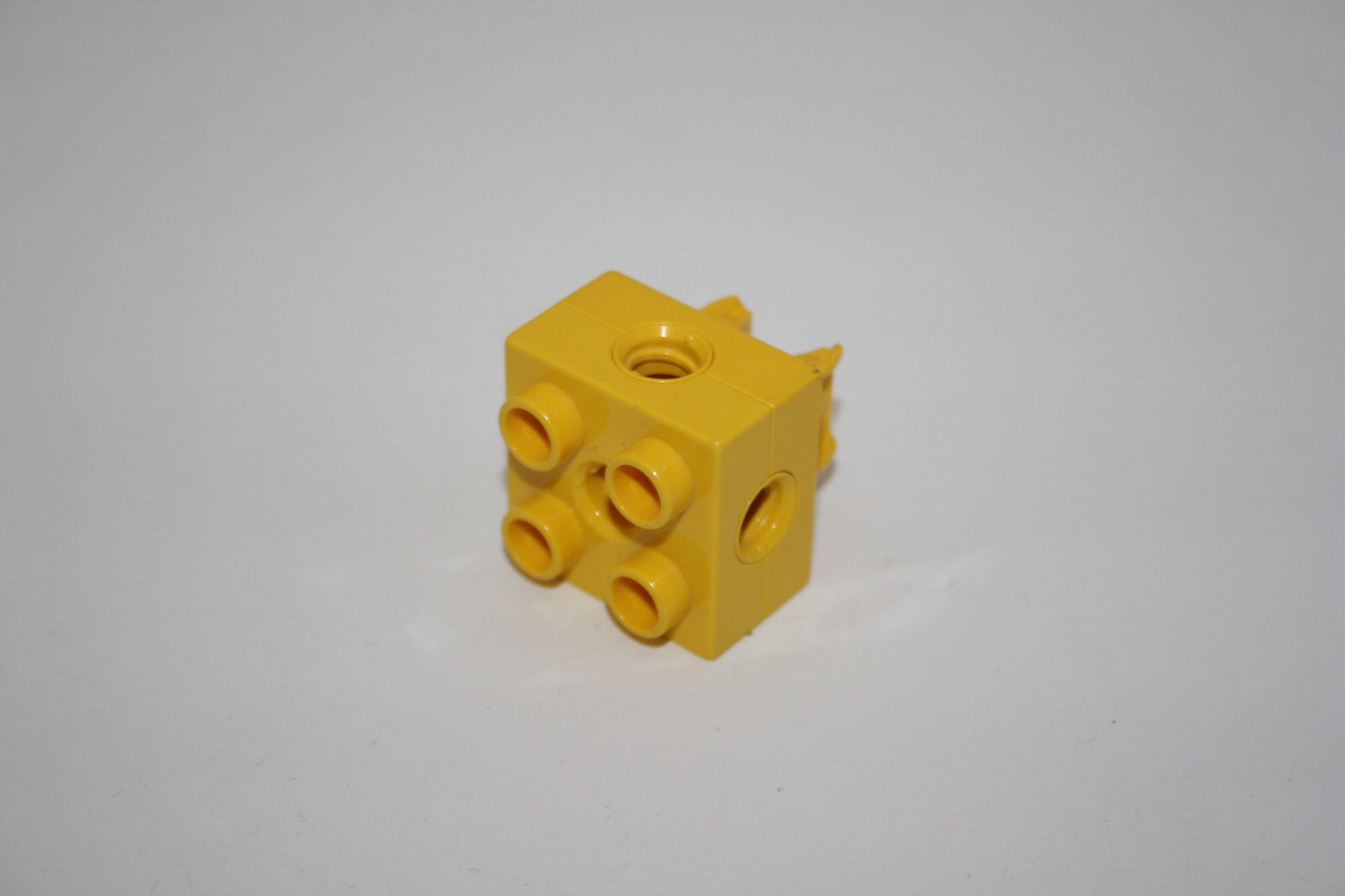 Duplo Toolo - 2x2 Stein mit Clip unterm Stein - 74957c01 - gelb - Ersatzteil - Ersatzteil/Einzelteil
